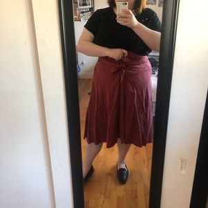 Deep coral skirt with tie belt and high low hem